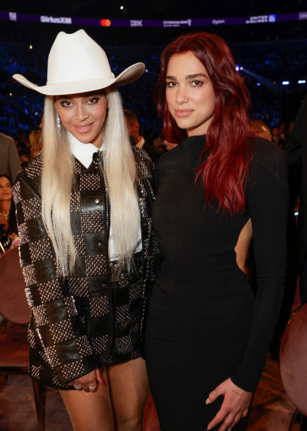 Beyoncé and Dua Lipa behind the scenes at The 66th Annual Grammy Awards, airing live from Crypto.com Arena in Los Angeles, California, Sunday, Feb. 4 on the CBS Television Network — frame 46/80 (437×612)