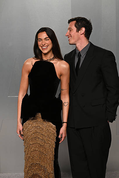 Dua Lipa and Callum Turner attend the Vanity Fair Oscar Party held at Los Angeles County Museum of Art in Beverly Hills, Los Angeles, California, USA. Picture date: Sunday March 15, 2026 — frame 101/107 (408×612)