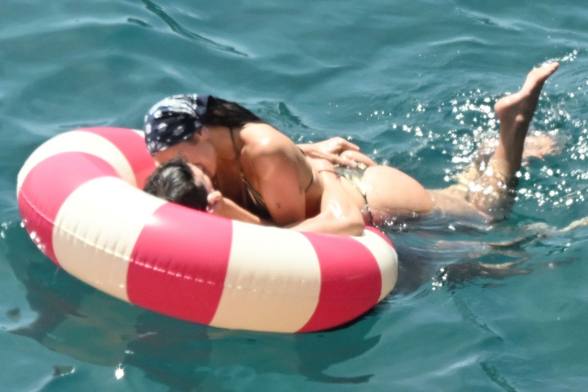 Dua Lipa and Callum Turner on the Sea in a Float