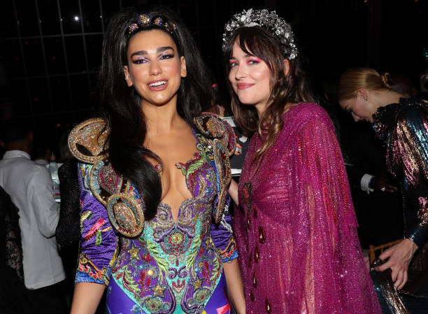Dua Lipa and Dakota Johnson attend The 2019 Met Gala Celebrating Camp: Notes on Fashion at Metropolitan Museum of Art on May 06, 2019 in New York City.