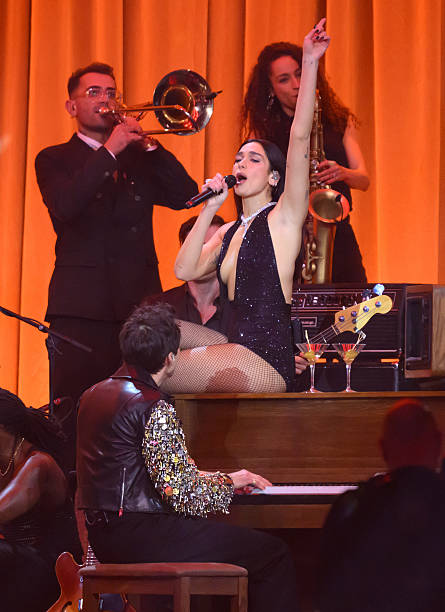 Dua Lipa and Mark Ronson Perform on Stage During