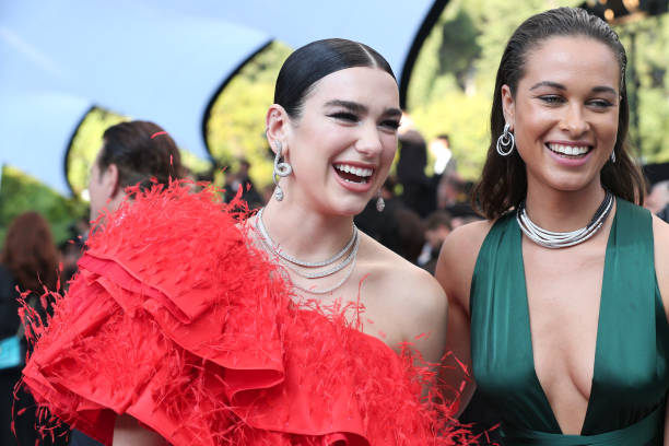 Dua Lipa and Sarah Lysander Attend the Amfar Canne (612×408)