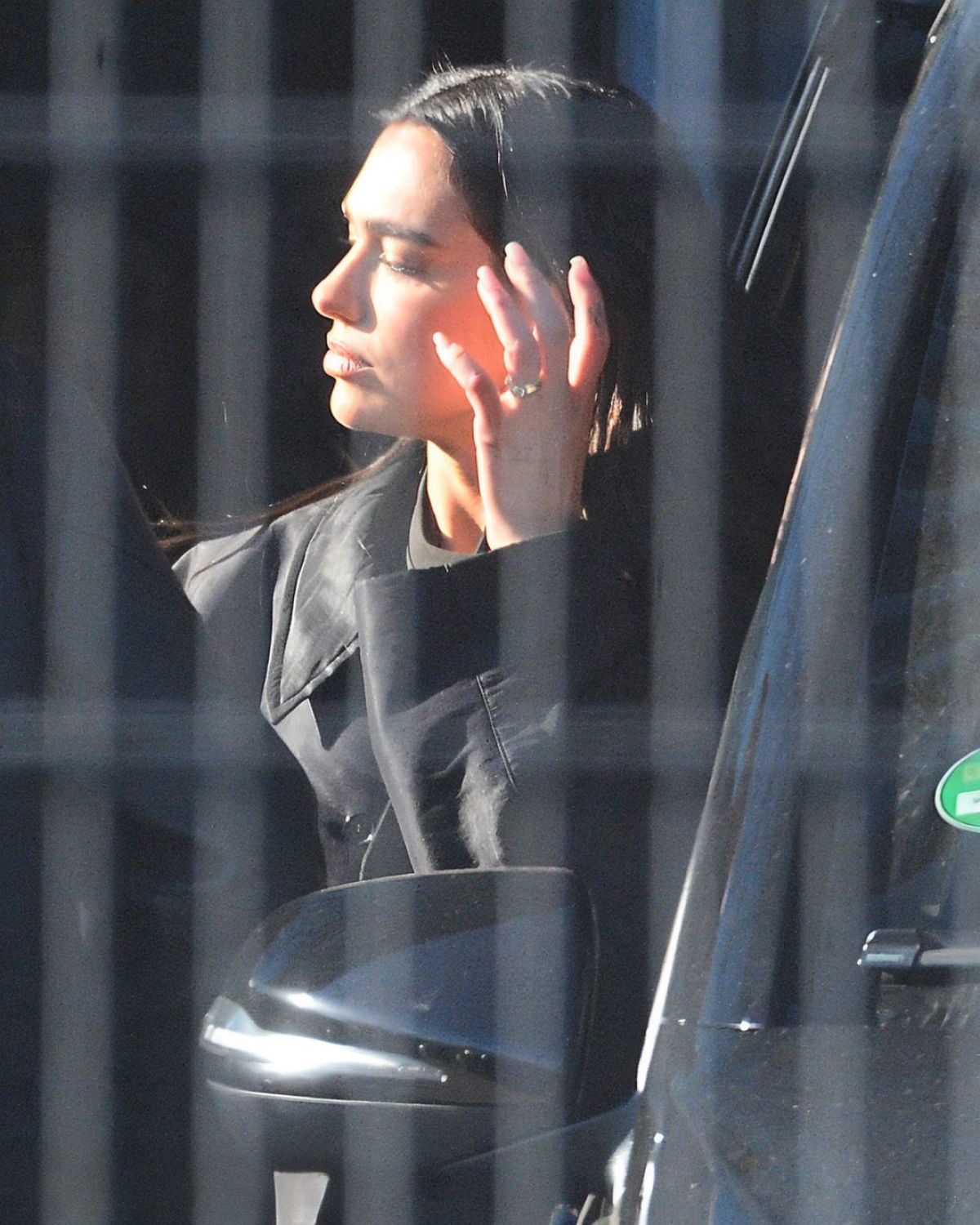 Dua Lipa at a Cigarette Break While Filming a Comm