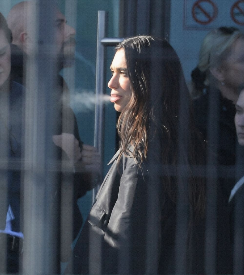 Dua Lipa at a Cigarette Break While Filming a Comm