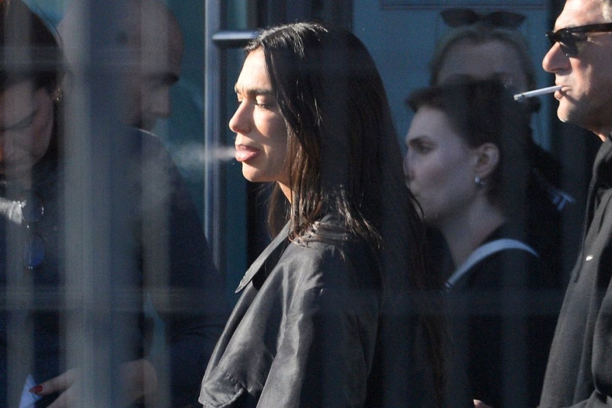 Dua Lipa at a Cigarette Break While Filming a Comm