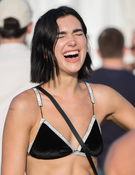 Dua Lipa Attends Day Three of Glastonbury Festival