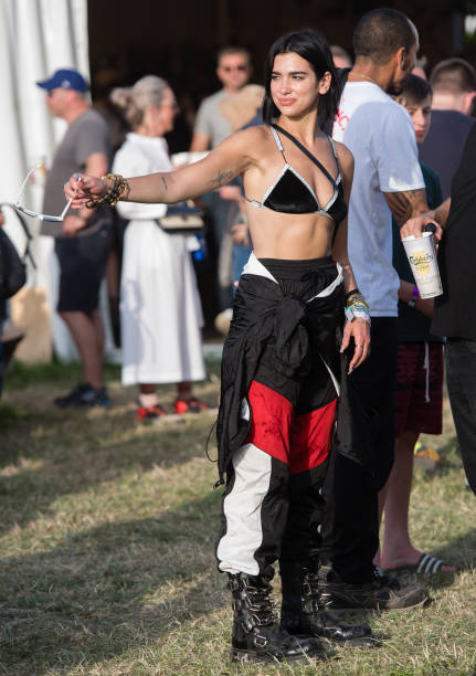 Dua Lipa Attends Day Three of Glastonbury Festival