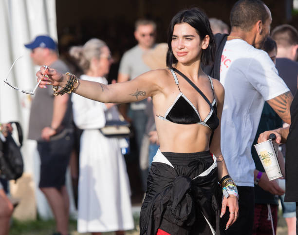 Dua Lipa Attends Day Three of Glastonbury Festival
