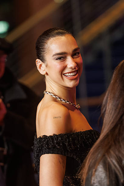 Dua Lipa Attends the Rosebush Pruning Premiere Dur (408×612)