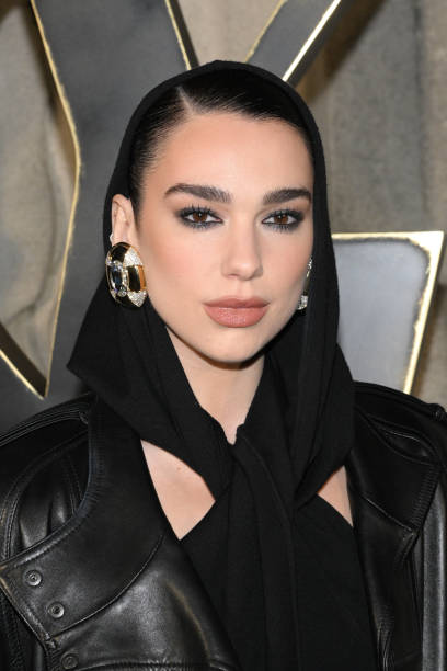 Dua Lipa attends the Saint Laurent Womenswear Fall Winter 2023-2024 show as part of Paris Fashion Week on February 28, 2023 in Paris, France — frame 6/8 (408×612)