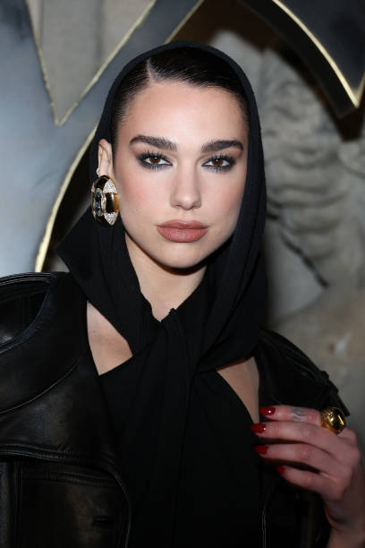 Dua Lipa attends the Saint Laurent Womenswear Fall Winter 2023-2024 show as part of Paris Fashion Week on February 28, 2023 in Paris, France — frame 3/8 (408×612)