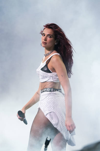Dua Lipa headlines The Pyramid Stage during day three of Glastonbury Festival 2024 at Worthy Farm, Pilton on June 28, 2024 in Glastonbury, England. Founded by Michael Eavis in 1970, Glastonbury Festival features around 3,000 performances across over 80 stages. Renowned for its vibrant atmosphere and iconic Pyramid Stage, the festival offers a diverse lineup of music and arts, embodying a spirit of community, creativity, and environmental consciousness (408×612)