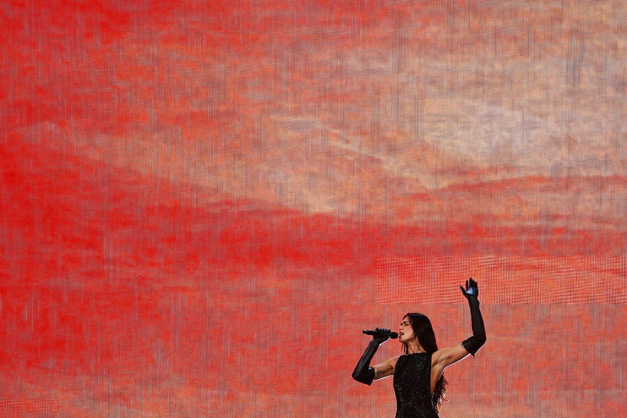 Dua Lipa in Bold Stage Looks at Radical Optimism