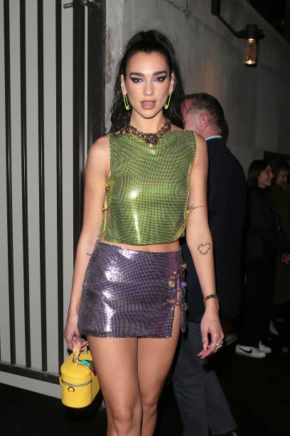 Dua Lipa seen attending Versace & Frieze event / party at Toklas Restaurant on October 15, 2021 in London, England — frame 10/20 (408×612)