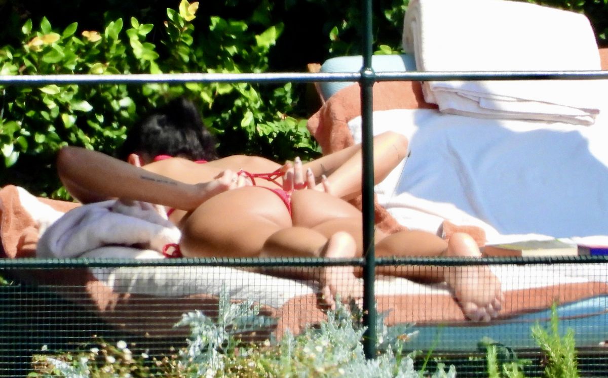 Dua Lipa Sunbathes Poolside in Bikini at her Frien