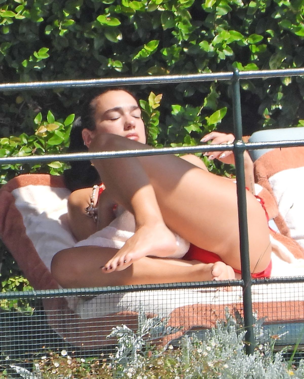 Dua Lipa Sunbathes Poolside in Bikini at her Frien