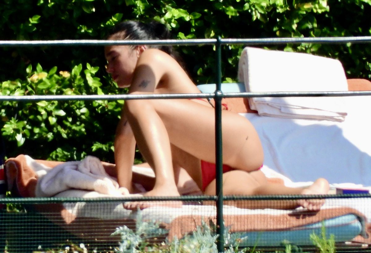Dua Lipa Sunbathes Poolside in Bikini at her Frien