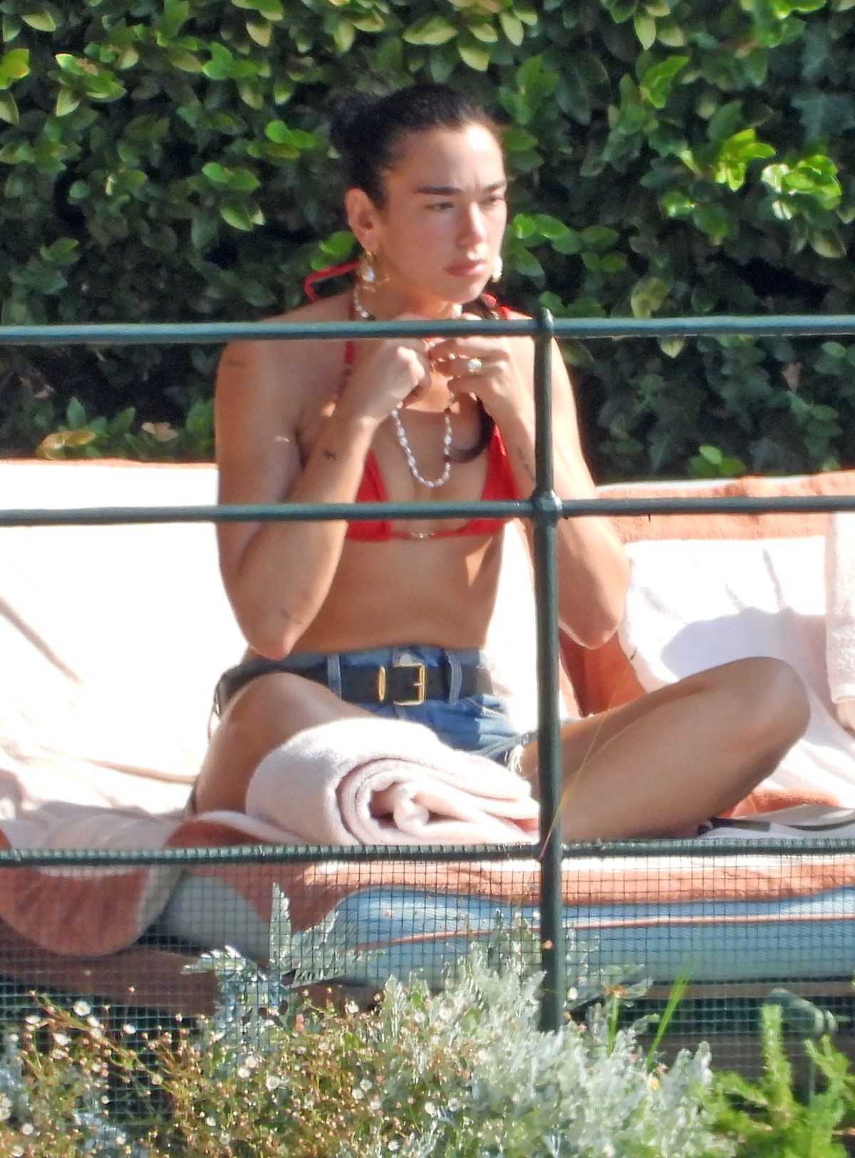 Dua Lipa Sunbathes Poolside in Bikini at her Frien